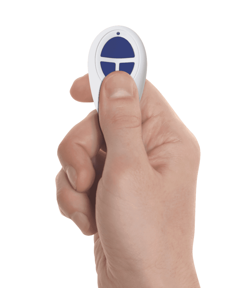 Close-up of a hand reprogramming a Gliderol garage door remote. - Gliderol