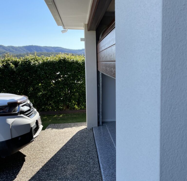A modern Gliderol garage door, demonstrating correct operation after troubleshooting safety sensors. - Gliderol