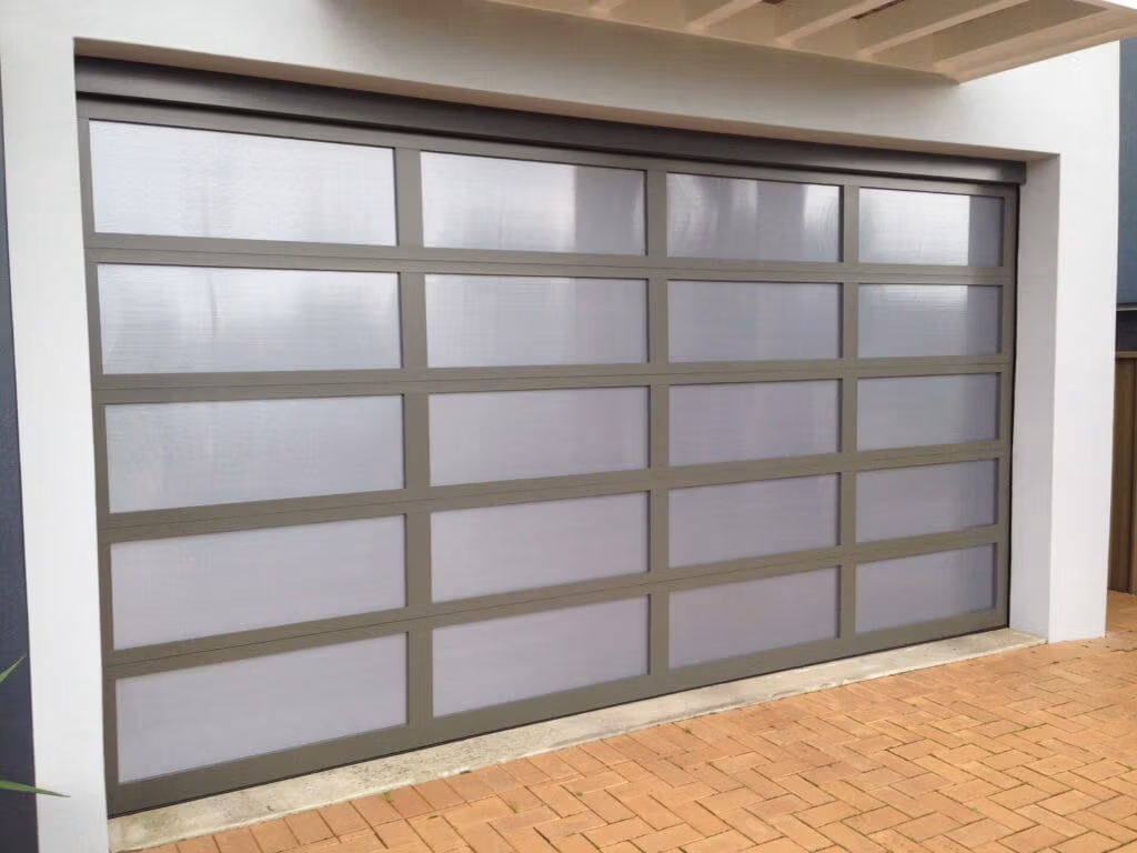 Danmar Clearlite in dark grey frame with perspex inserts Gliderol Danmar Clearlite garage door featuring acrylic garage door panels for natural light. - Gliderol