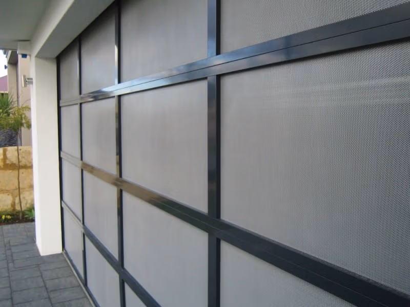 10 - Perfalite 18 - 2 Gliderol Danmar Perfalite garage door with perforated aluminium inserts for ventilation. - Gliderol